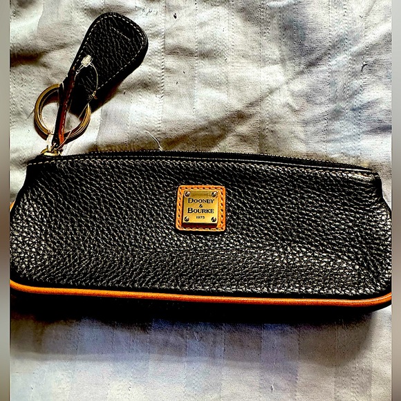 Dooney & Bourke Handbags - Dooney&Burke Small black leather wristlet with a Tan trim